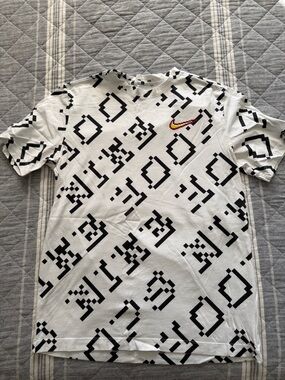 Nike White Short-Sleeve Pixel Pattern Tee with Red/Gold Swoosh